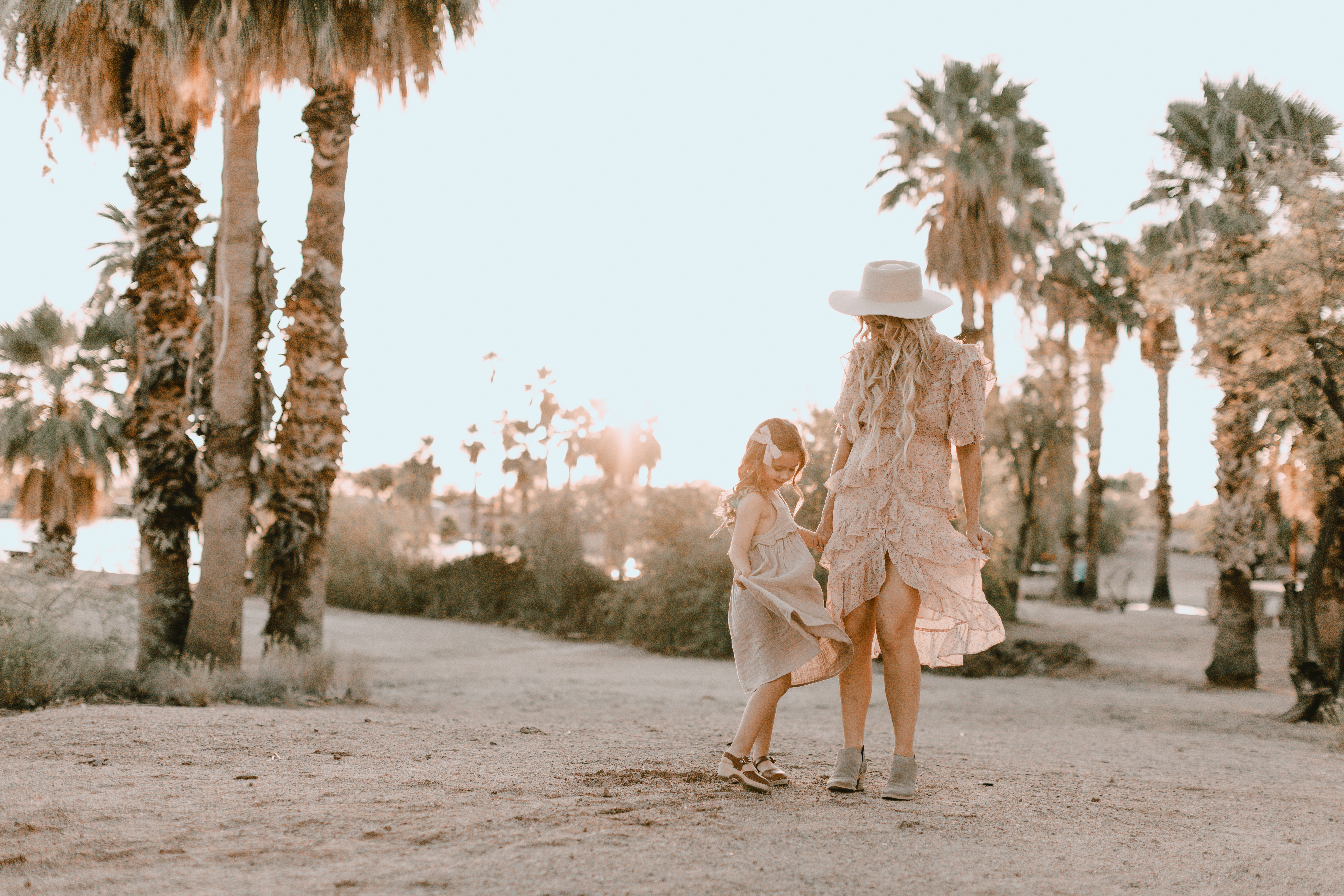 mother and daughter standing amongst the palm trees #familyphotos #mommyandme #thelovedesignedlife