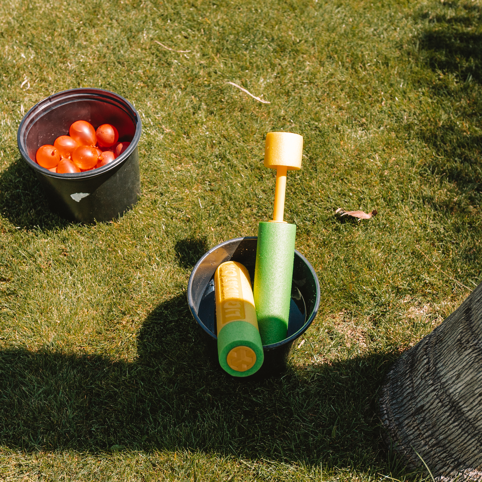 fill the bucket with these water squirters. #outdoorgames #backyardfun #watergames