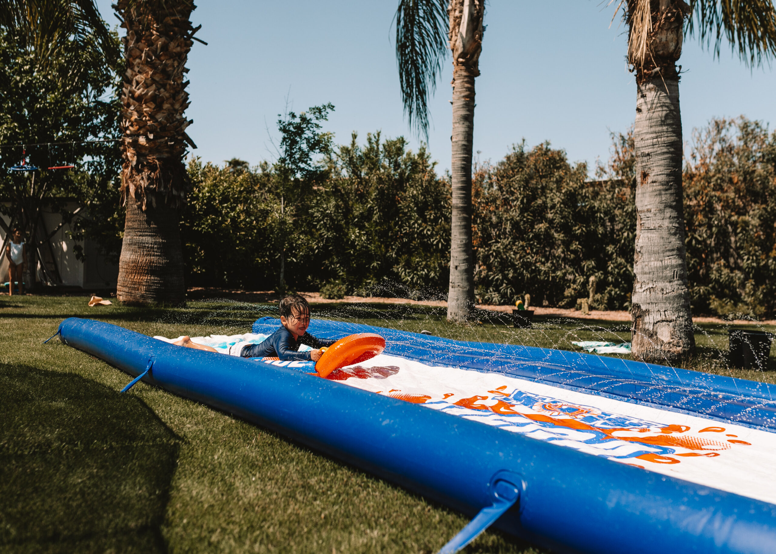 slip and slide water fun for our backyard field day! #slipandslide #backyardfun #waterplay #fieldday