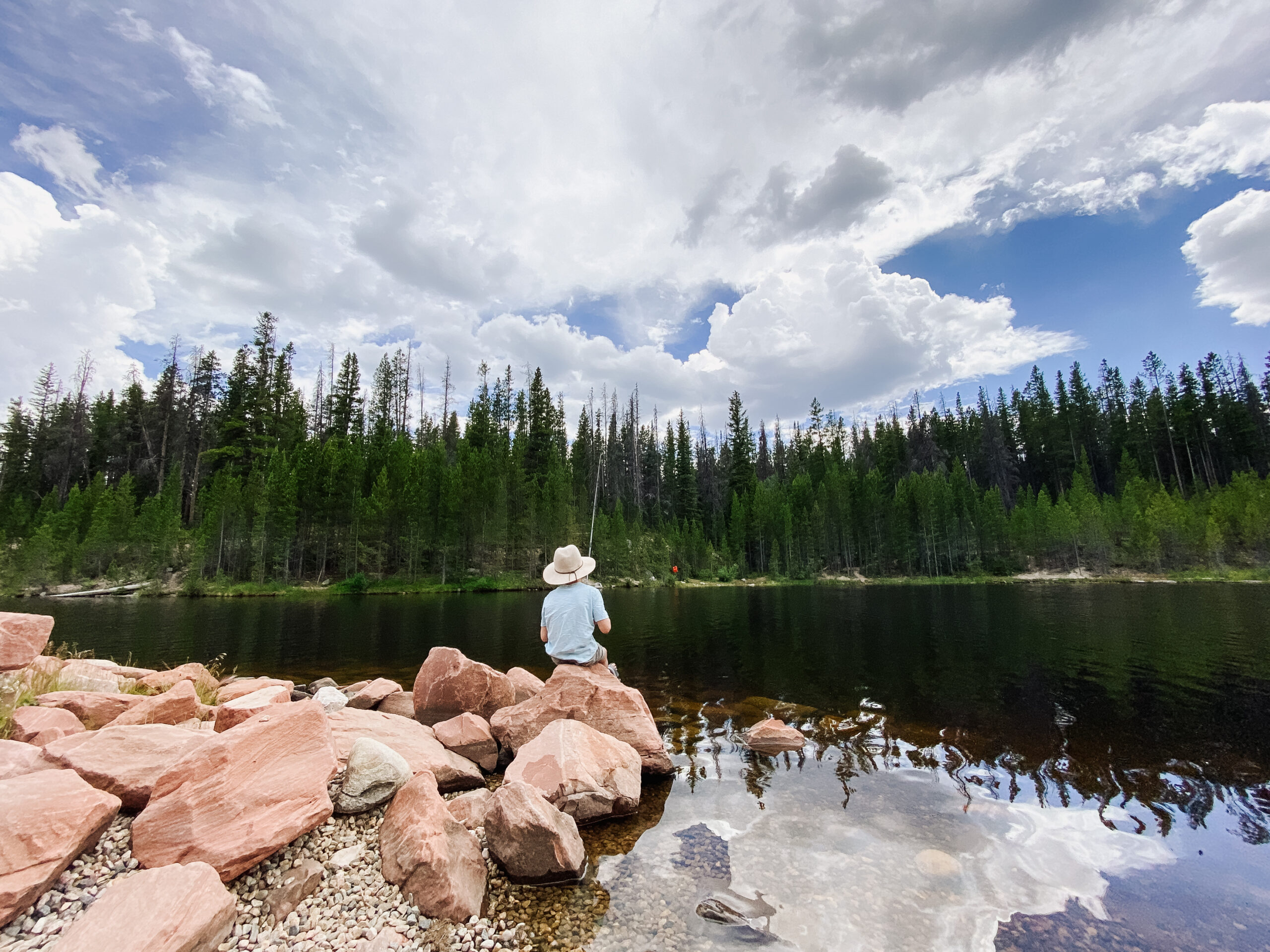 a boy fishing on the lake. #thelovedesignedlife #fishing #getoutside #travelwithkids