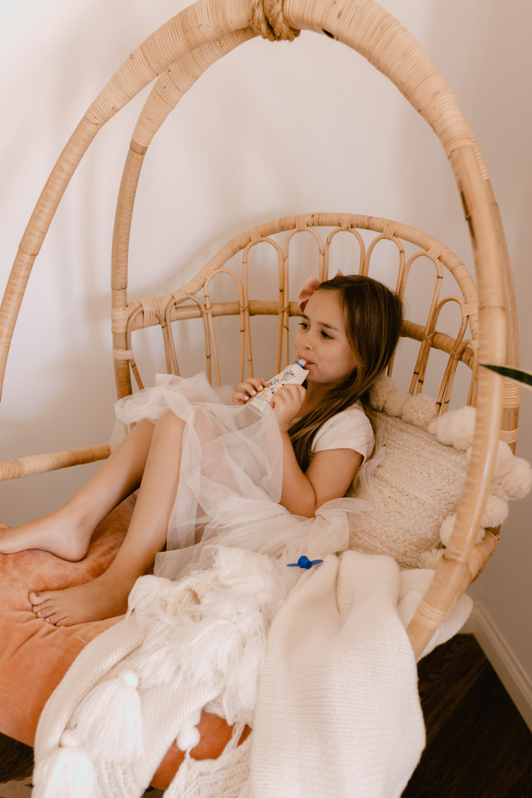 the favorite spot in the house - a rattan hanging chair. #thelovedesignedlife #theldldhome #bohohome 