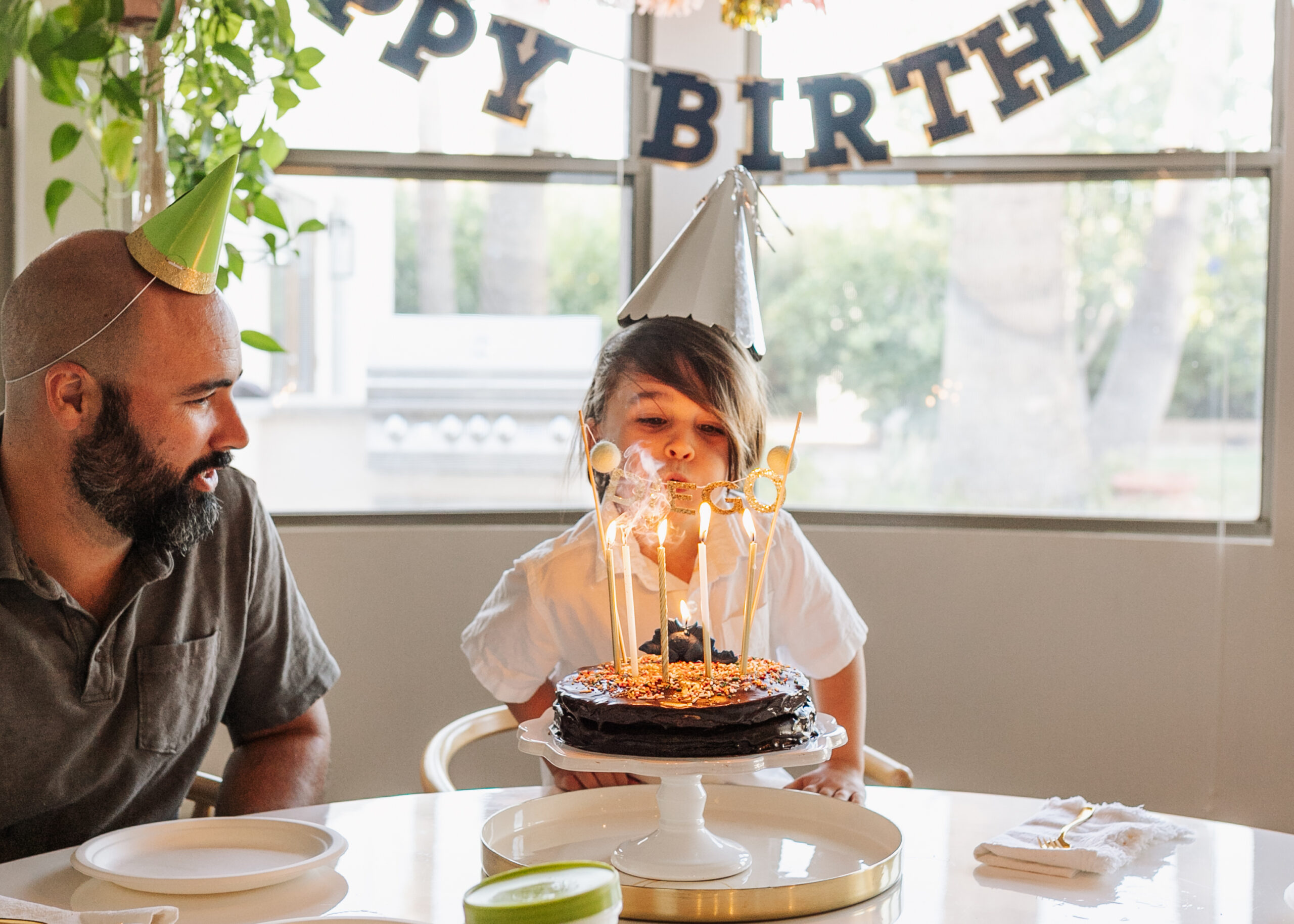 blowing out the candles on his homemade birthday cake! #thelovedesignedlife #glutenfreecake 