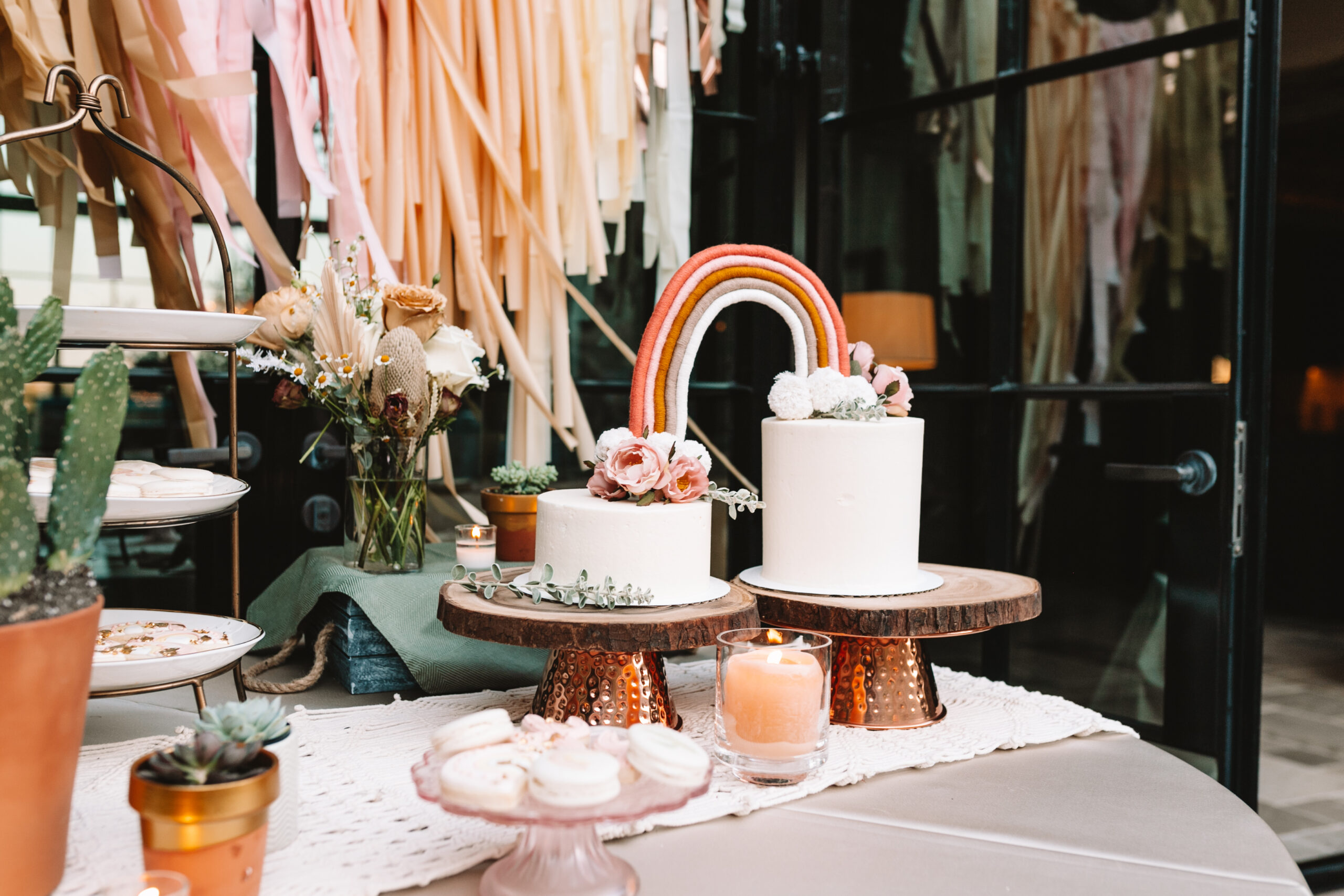 love how our double cake with macrame rainbow came out! #rainbowcake #deserttable #babyshowertreats #bohobabyshower