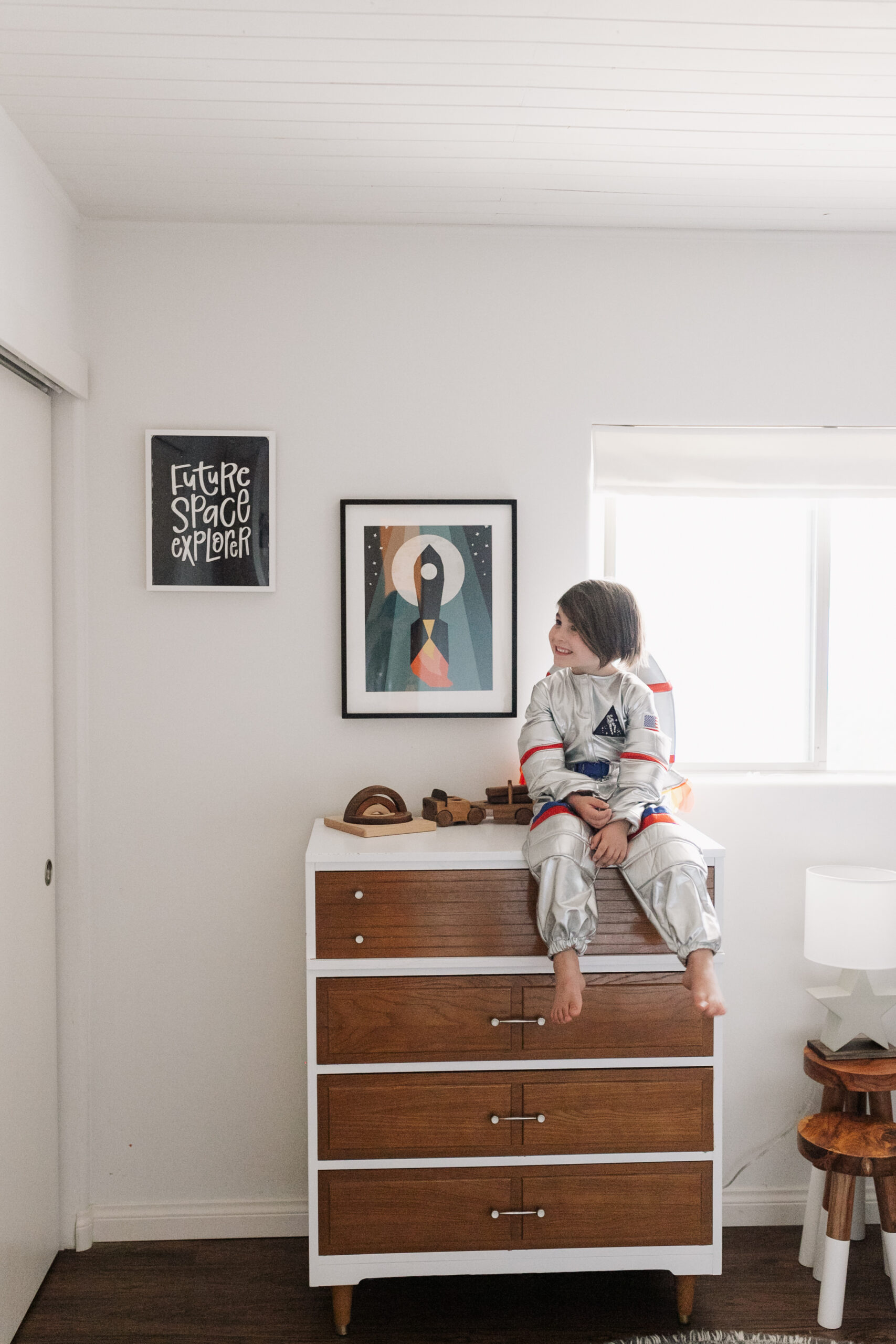 this artwork from minted perfectly complements the wallpaper in our space-inspired big boy room! #theldlhome #bedroom #kidsroom #outerspace