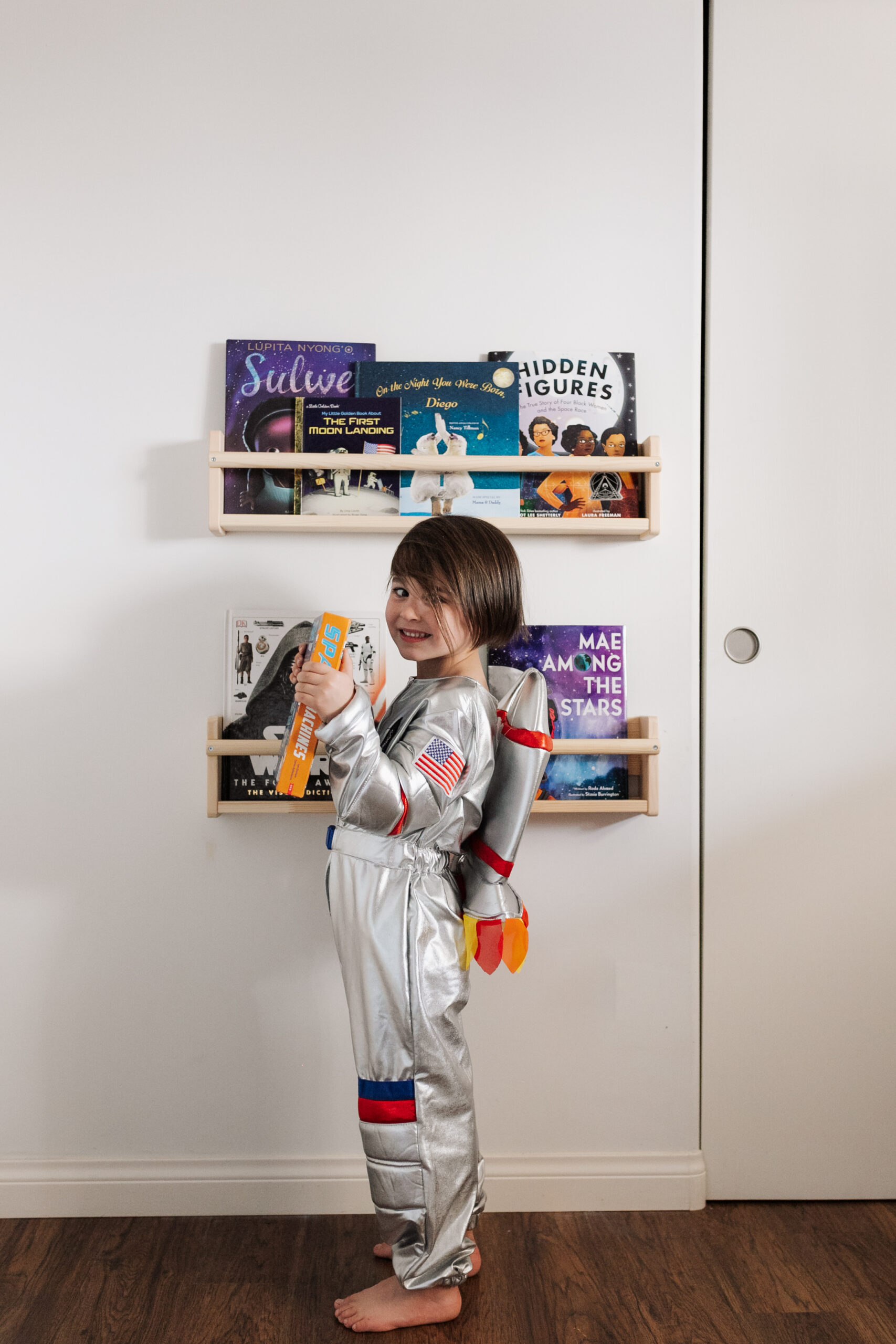 his little book nook with some of our favorite space books #theldlhome #thelovedesignedlife #spaceroom #kidsroom #kidsspaceroom #astronaut