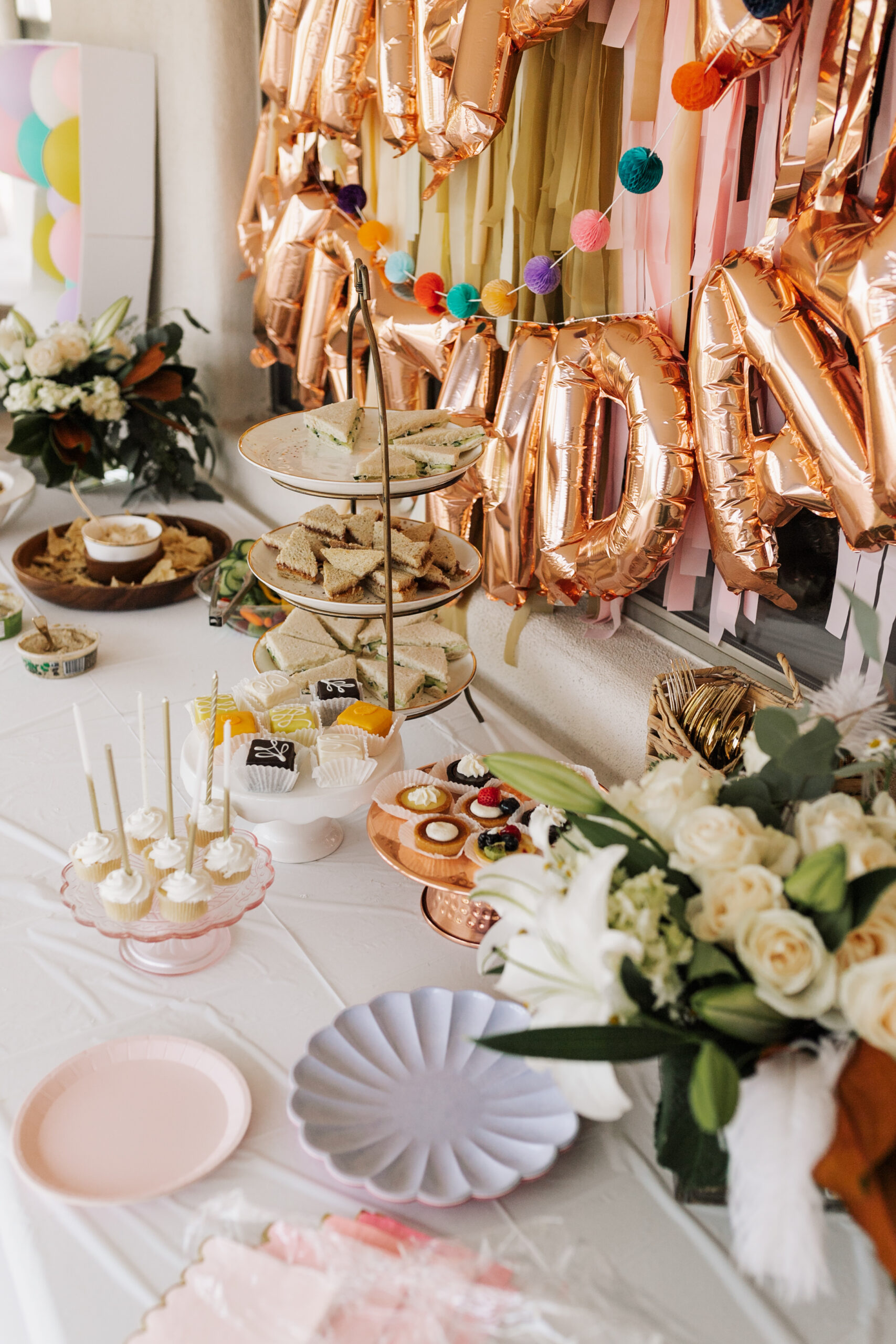 mini cupcakes, petit fours, and other small desserts for our mad hatter tea party #averymerryunbirthday #birthdayparty #partyideas #thelovedesigendlife