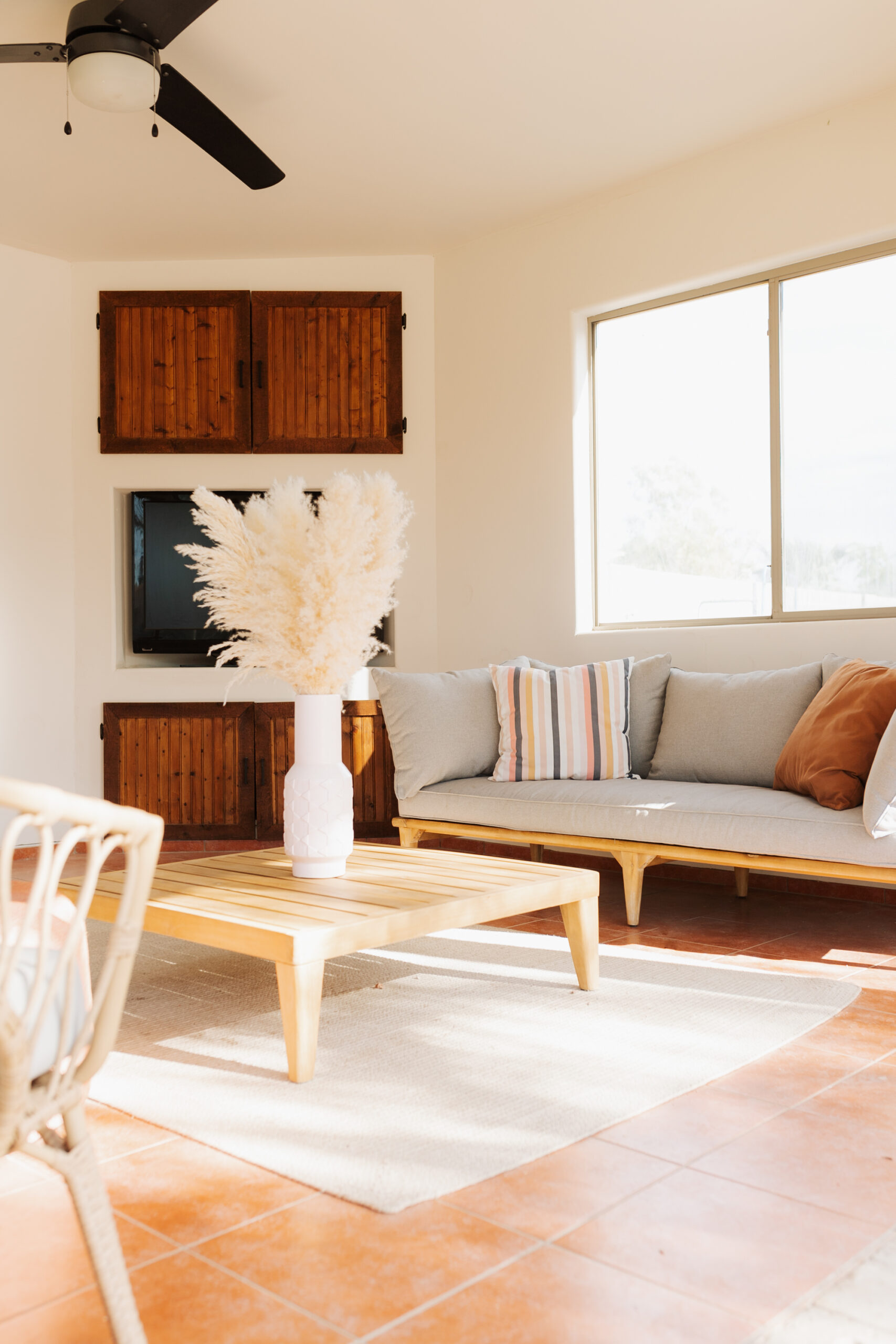 a peek at our pool ramada, with modern furniture and a beachy boho vibe #modernbackyard #arizonaliving #poolramada #backyarddesign