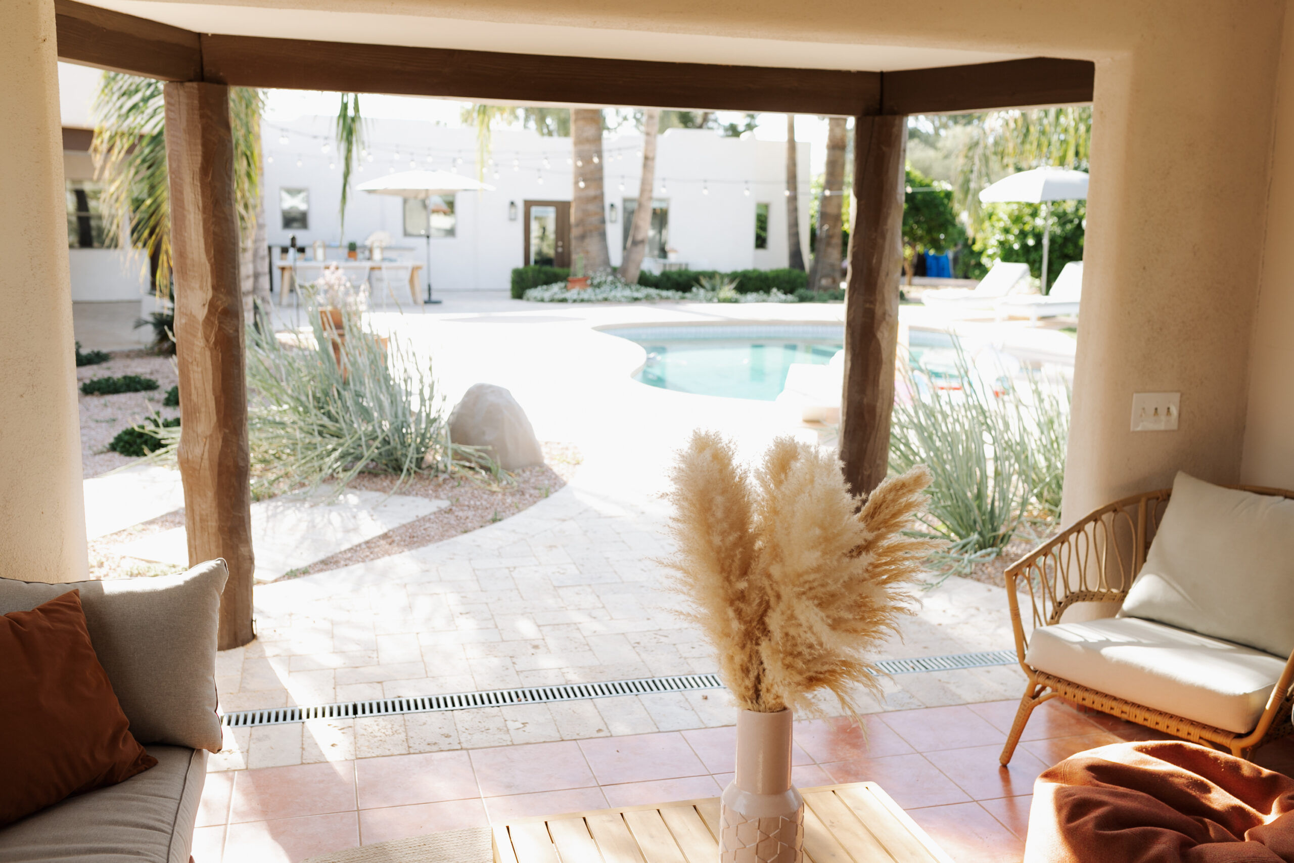 the view from our pool ramada, with modern furniture and a beachy boho vibe #modernbackyard #arizonaliving #poolramada #backyarddesign