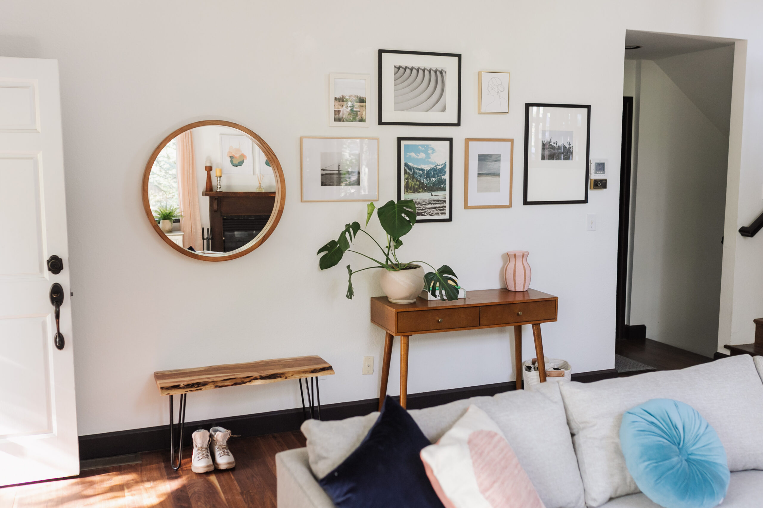 beautiful, simple gallery wall in this modern mountain home #modernmountain #mcm #entryway #livingroom #ourariticle