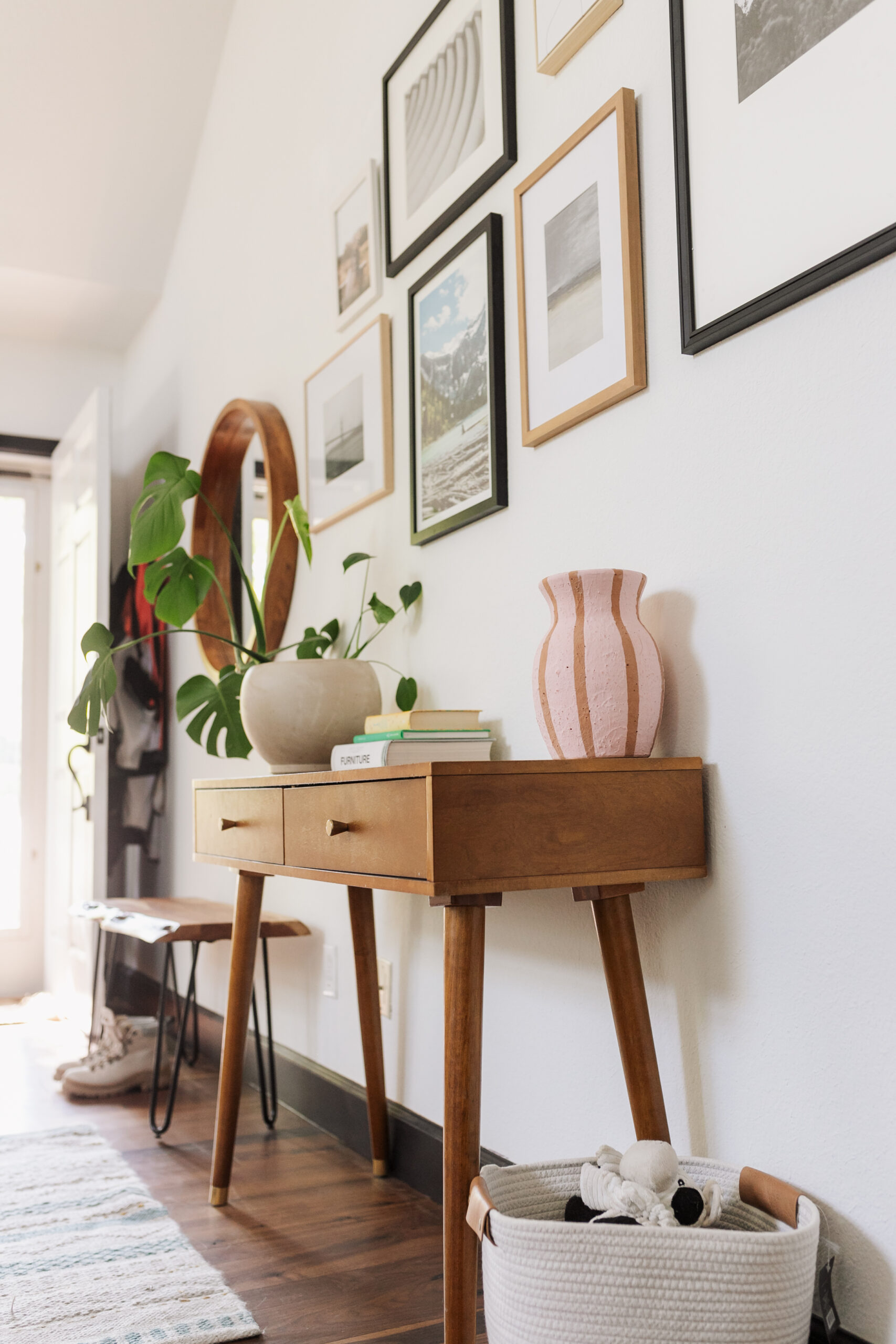 loving this functional and personalized entryway set up with a custom gallery wall #thelovedesignedlife #gallerywall #entryway #theldlhome