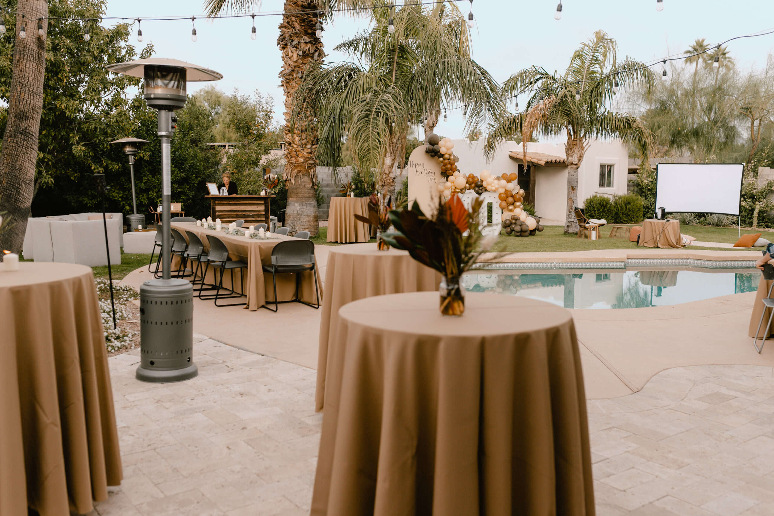 cocktail tables set up for guests to arrive at this surprise 40th birthday party #whiskeyandcigars #surprise40thparty #guysbirthdaypartyideas