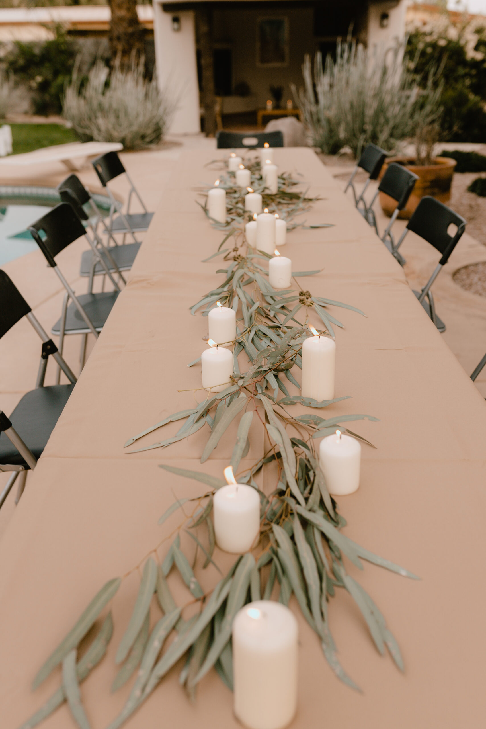 a simple tablescape of eucalyptus and candles #thelovedesignedlife #40thbirthdayparty #tablescape #theldlparties