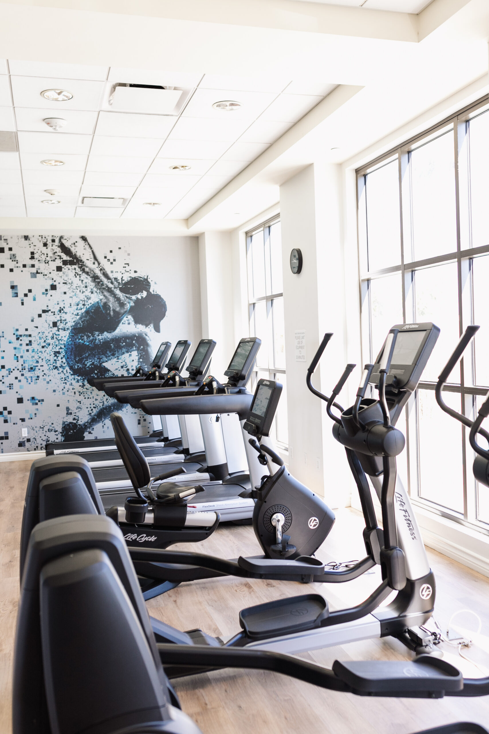 bright and clean gym overlooking the pool area at Sheraton Garden Grove Anaheim South