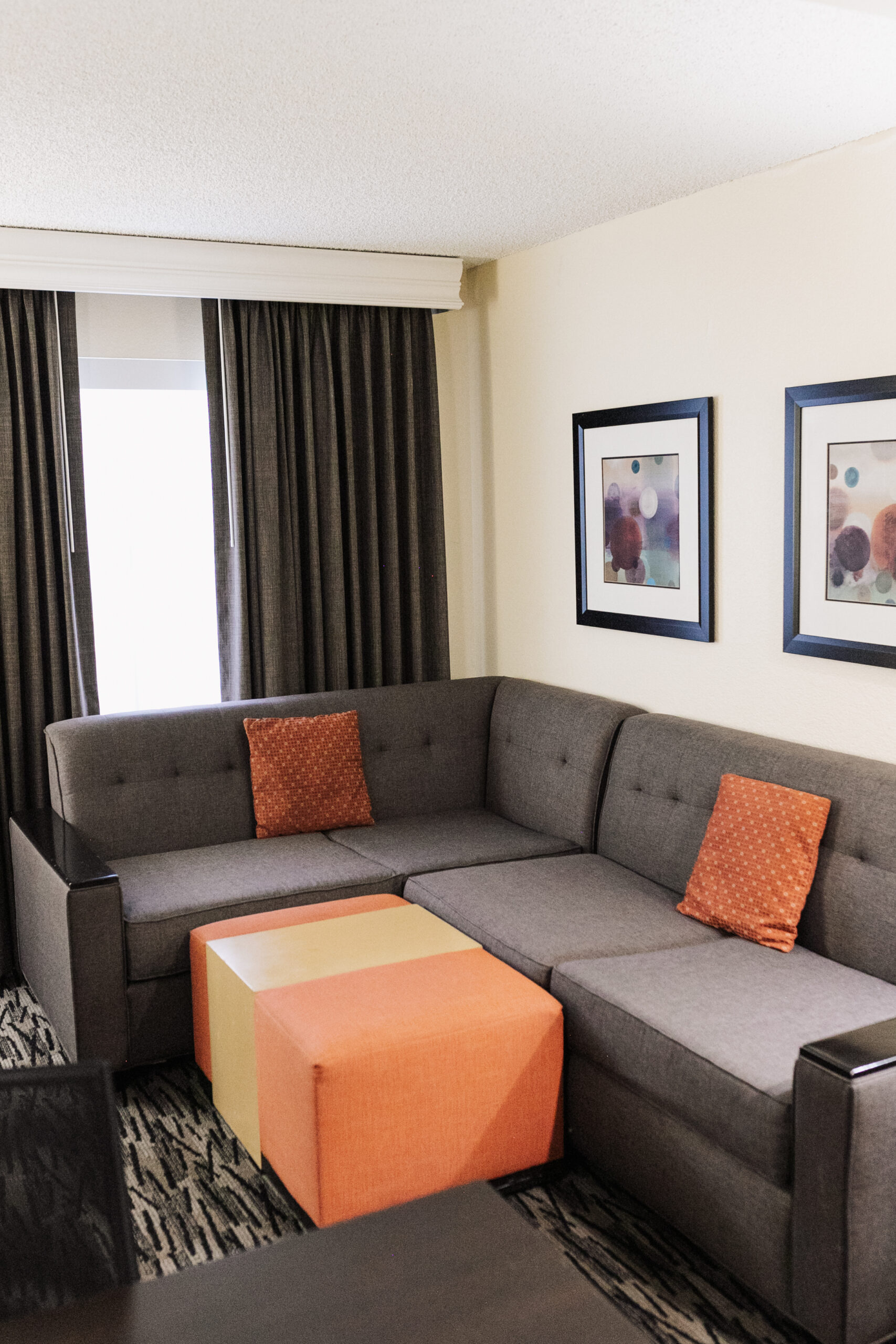 living area with a pullout couch at Homewood Suites by Hilton Anaheim Main Gate