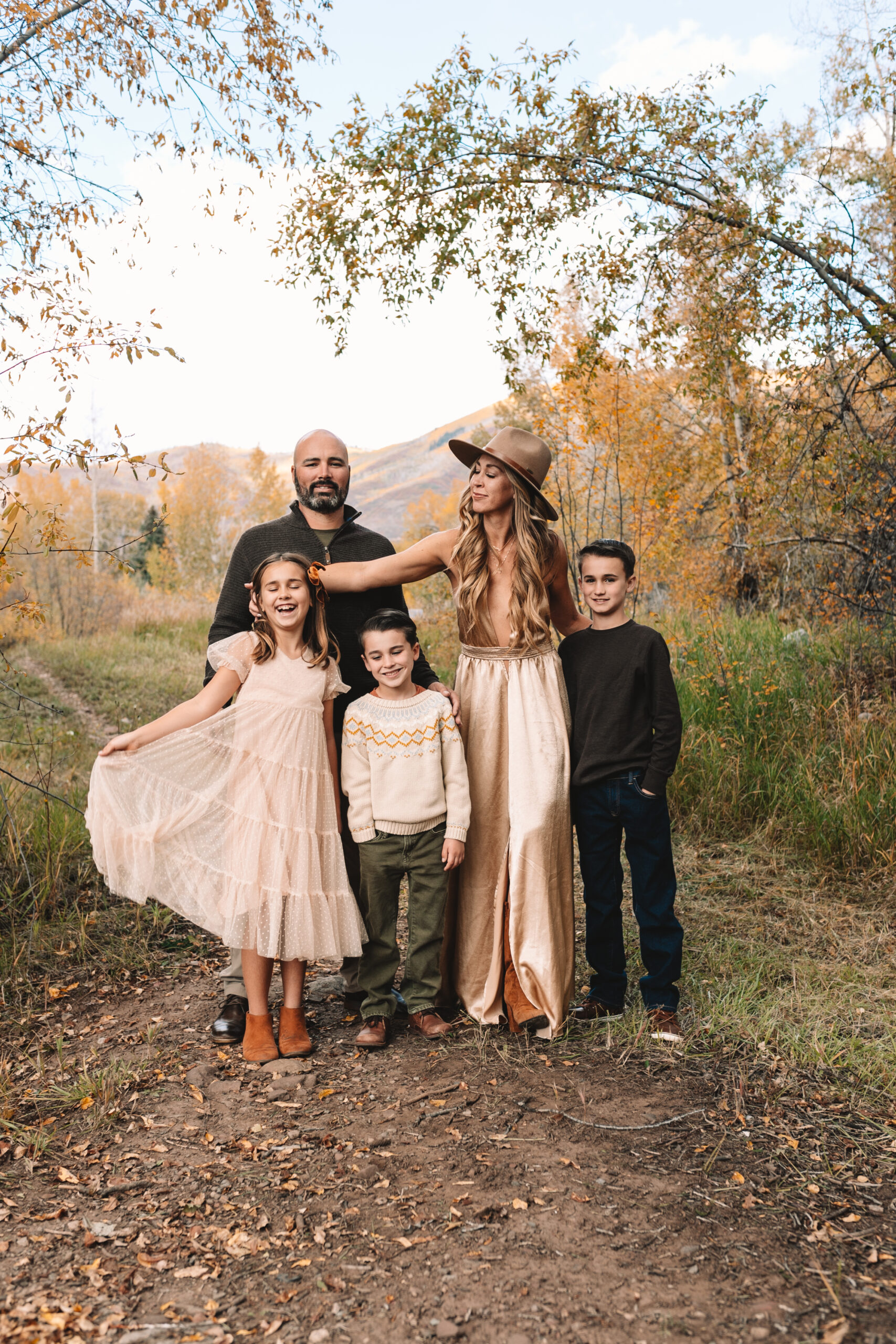 family of five standing in fall foliage. sharing our life lately update