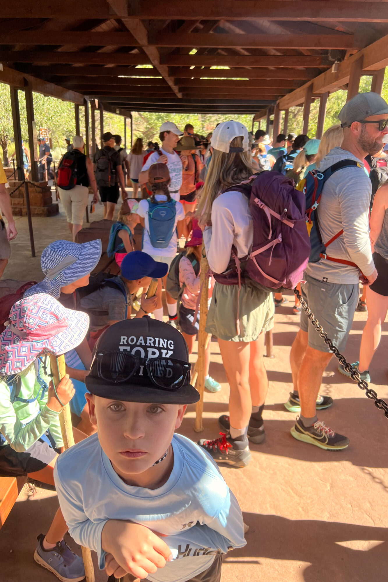 lines at the free shuttle site from the visitors center at Zion National Park in the summer