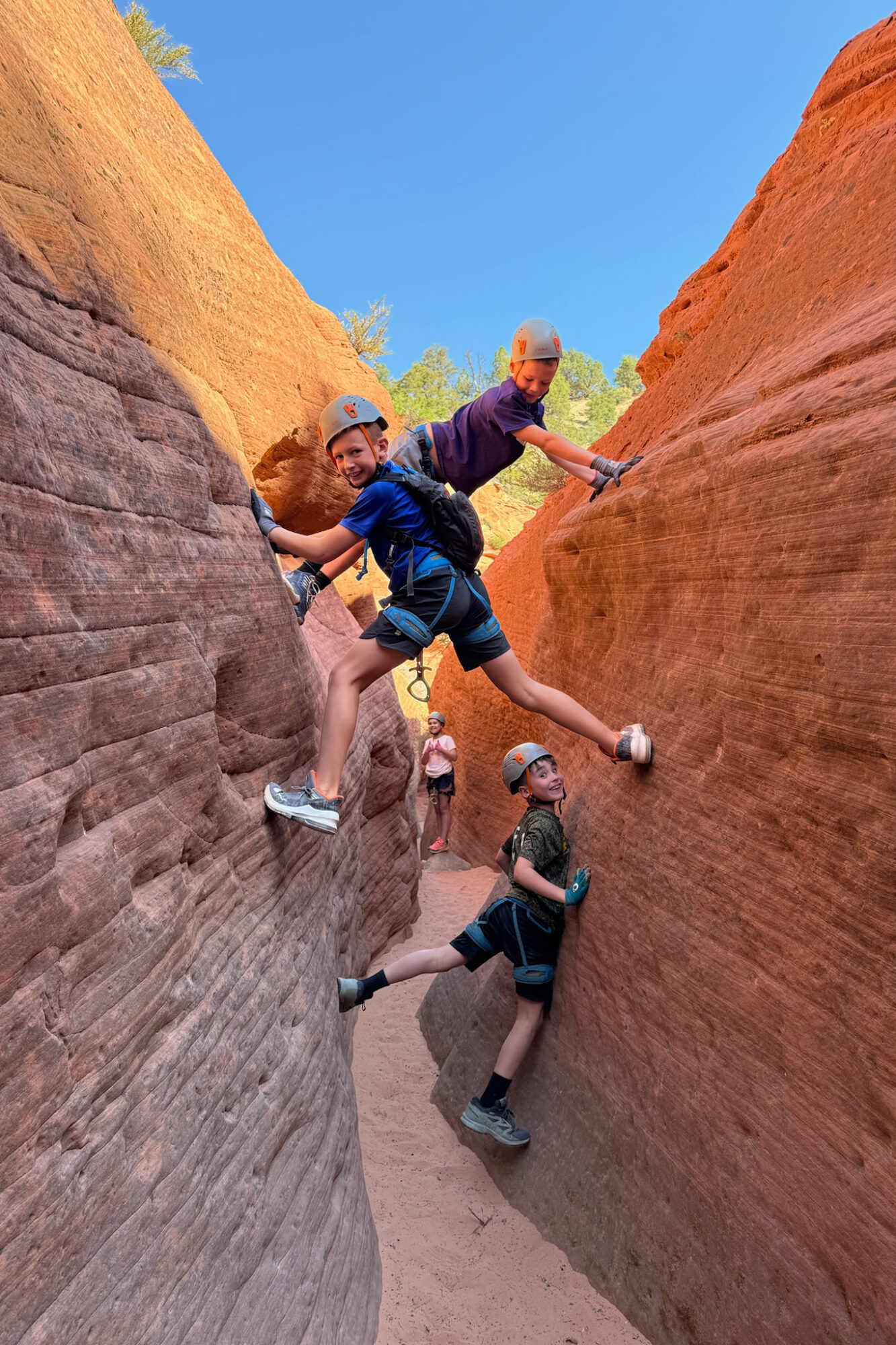 the kids loved climbing the rocks during the downtime between rappels on our tour